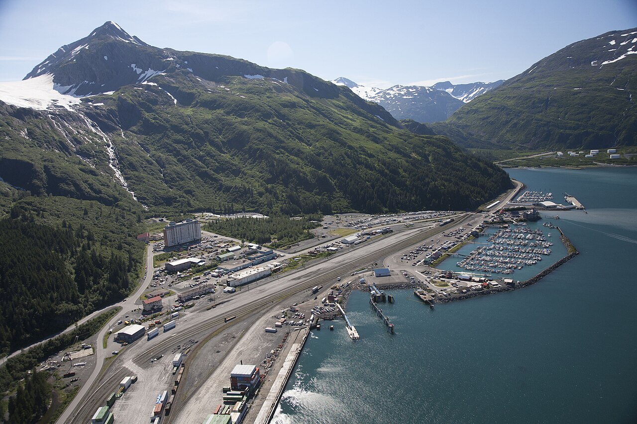 Begich Towers in Whittier Alaska surrounded by mountains and harbor